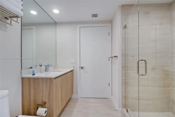 a bathroom with a sink and mirror