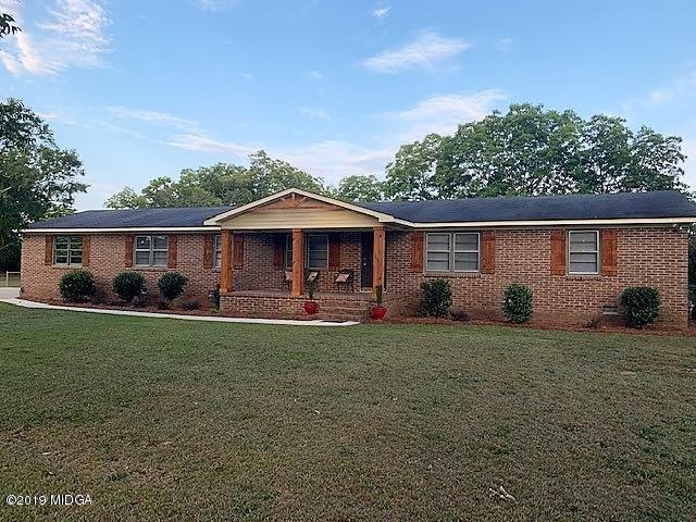 6609 Vinson Road Macon, GA 31216 - Photo 1 of 22 a front view of a house with garden