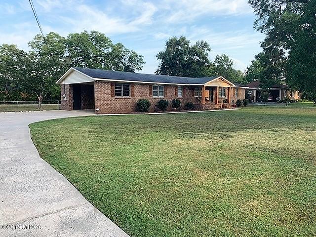 6609 Vinson Road Macon, GA 31216 - Photo 2 of 22 a front view of a house with garden