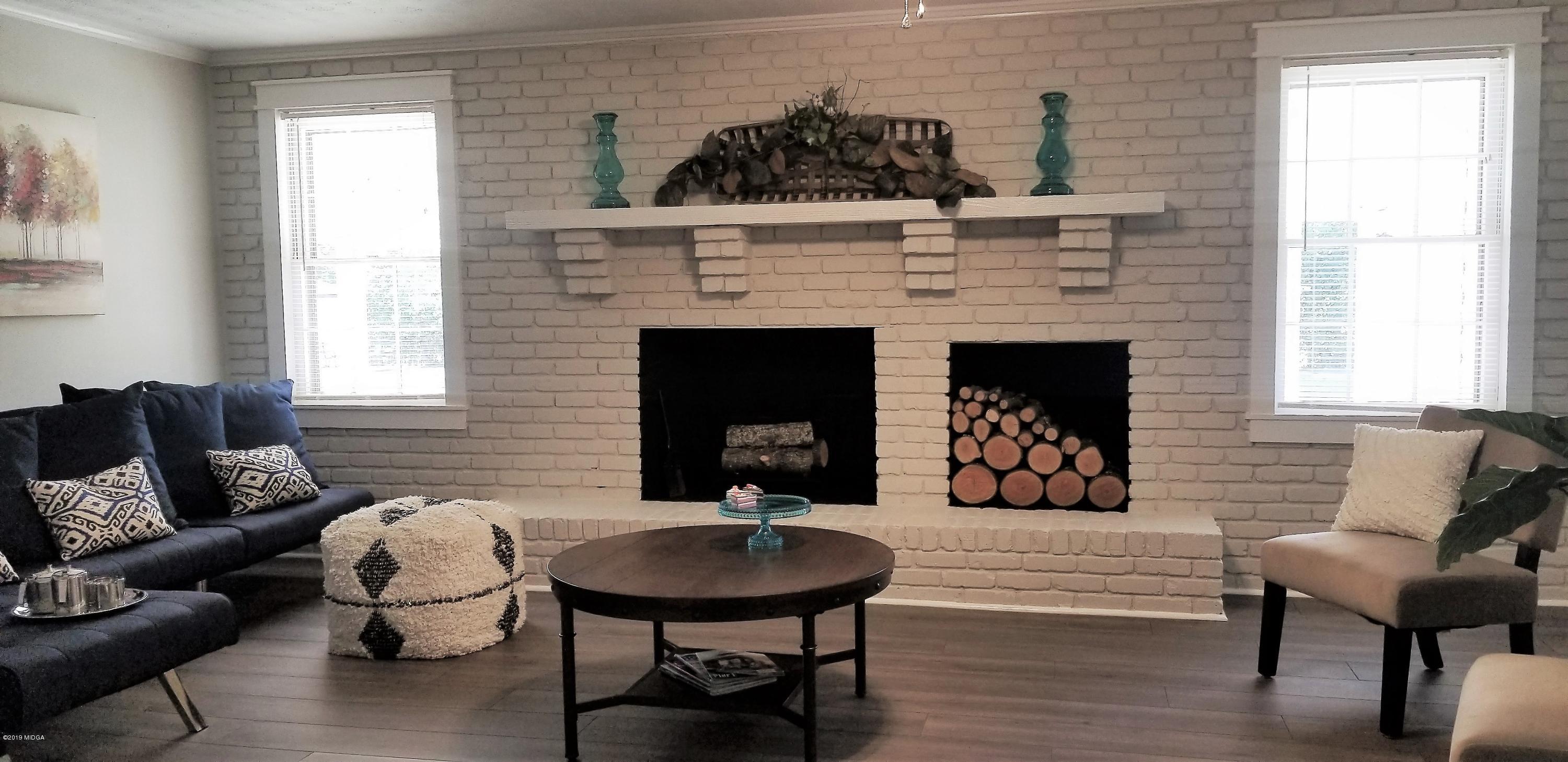 6609 Vinson Road Macon, GA 31216 - Photo 12 of 22 a living room with furniture and a fireplace