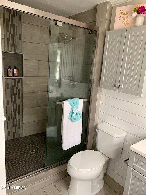 6609 Vinson Road Macon, GA 31216 - Photo 15 of 22 a bathroom with a toilet and a shower