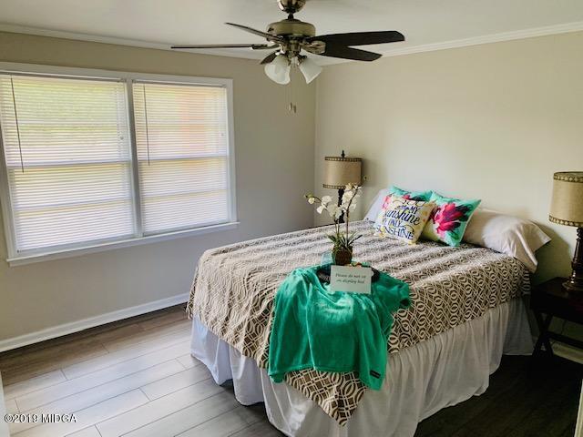 6609 Vinson Road Macon, GA 31216 - Photo 16 of 22 a bedroom with a bed and a window