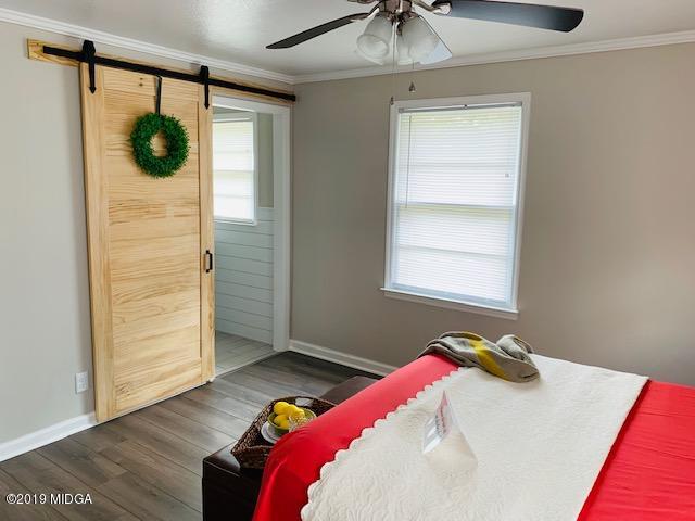6609 Vinson Road Macon, GA 31216 - Photo 22 of 22 a bedroom with a bed and a window