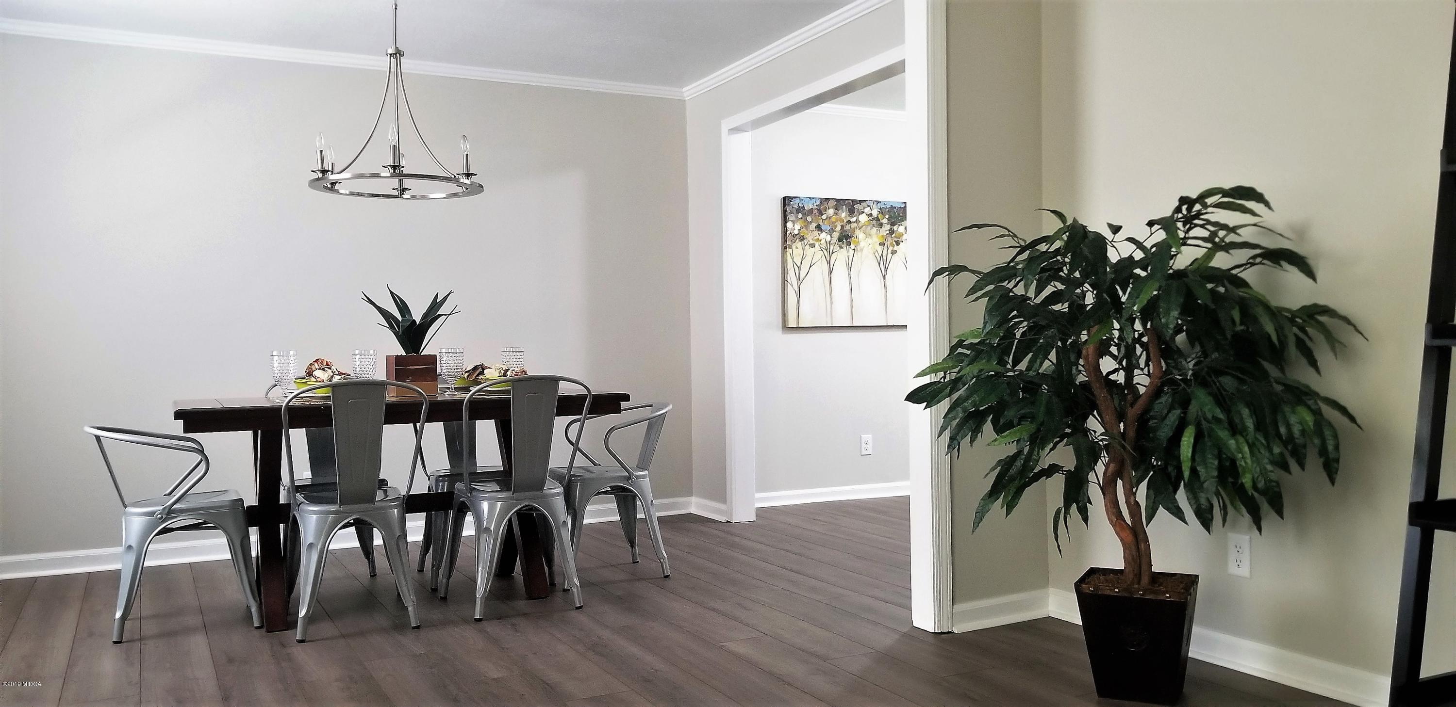 6609 Vinson Road Macon, GA 31216 - Photo 6 of 22 a view of a dining room with furniture and wooden floor