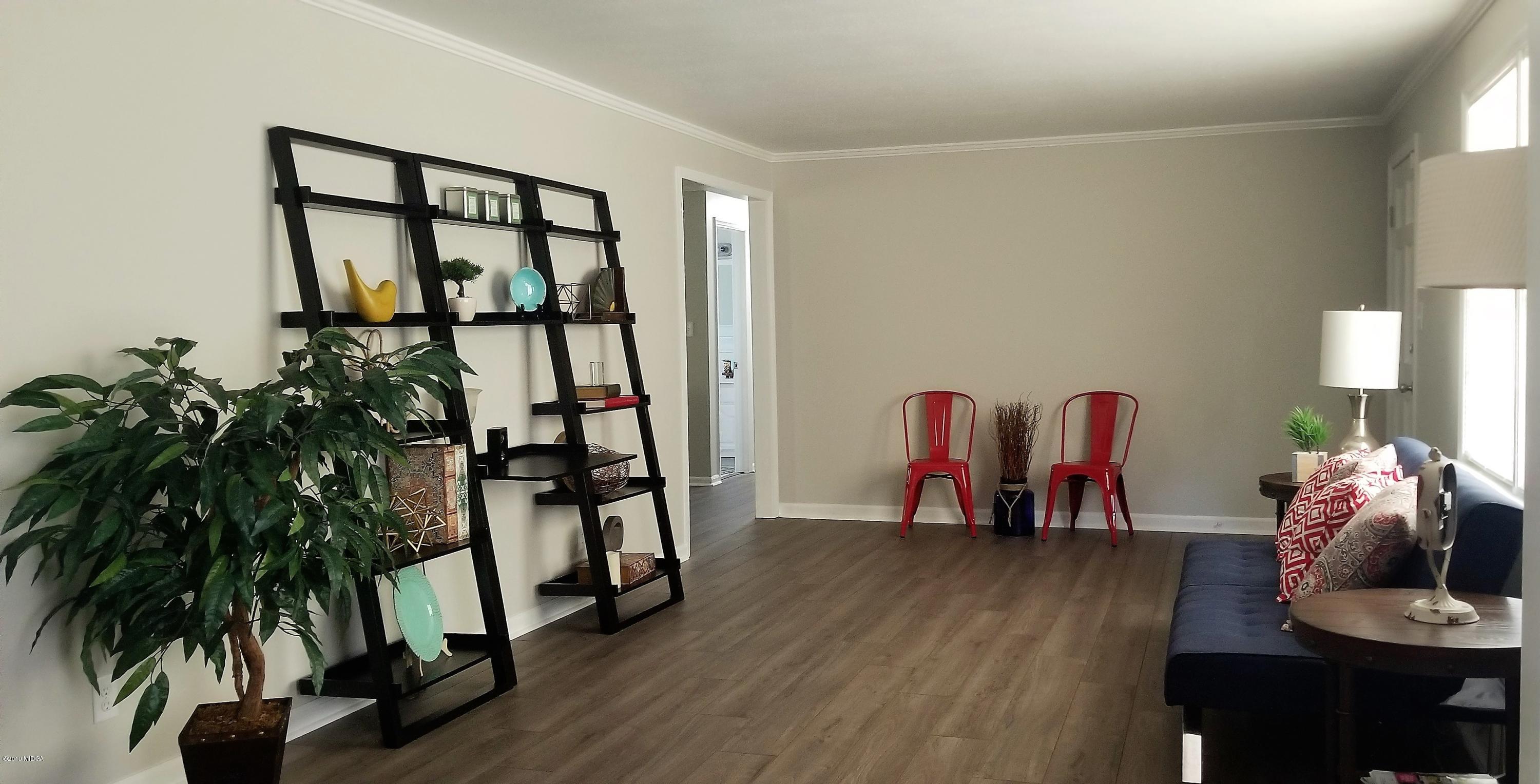 6609 Vinson Road Macon, GA 31216 - Photo 7 of 22 a living room with furniture and a potted plant