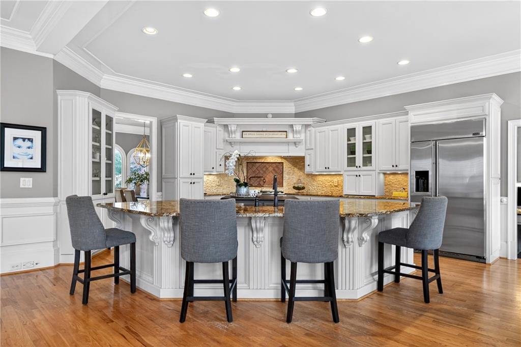 5040 Harrington Road Alpharetta, GA 30022 - Photo 14 of 54 a view of a dining room with furniture window and wooden floor