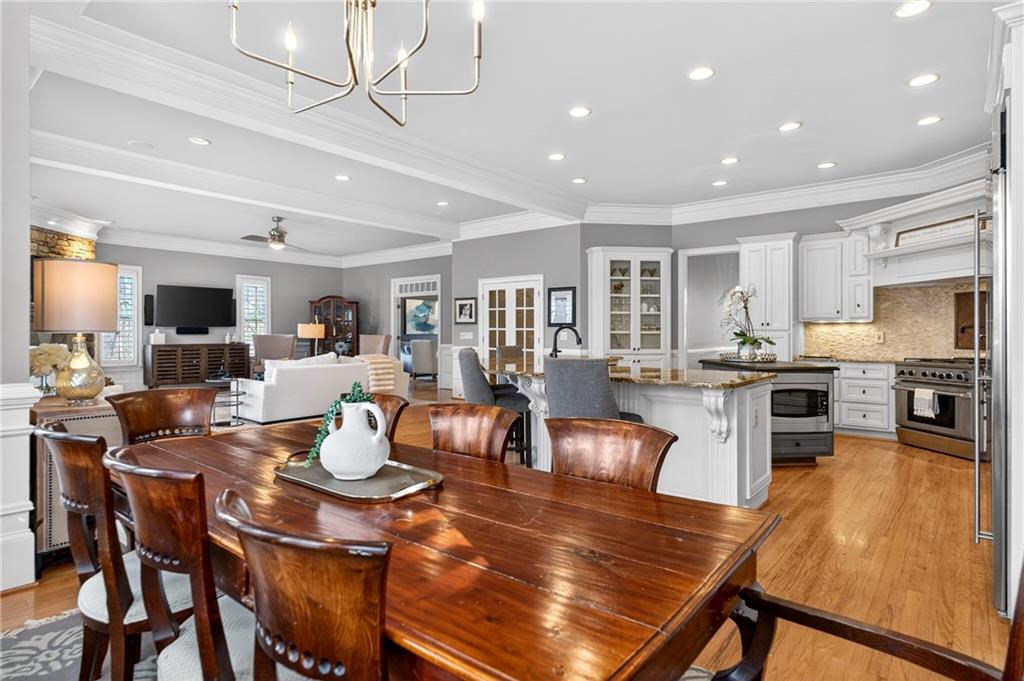 5040 Harrington Road Alpharetta, GA 30022 - Photo 16 of 54 a large kitchen with a table and chairs