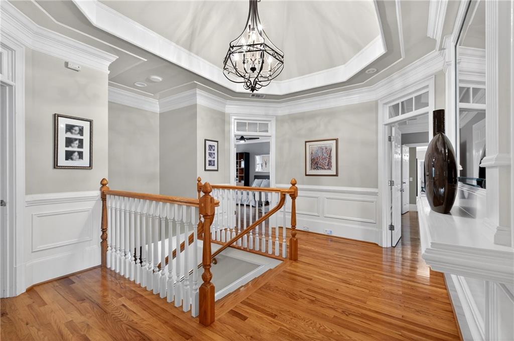 5040 Harrington Road Alpharetta, GA 30022 - Photo 22 of 54 a view of a hallway with wooden floor and windows