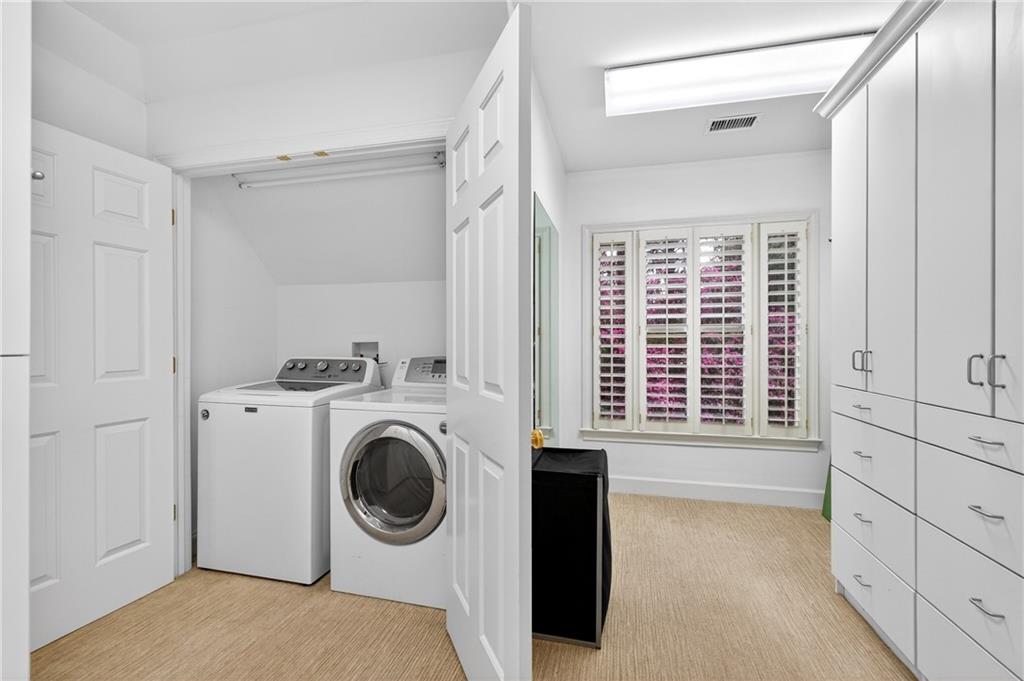 5040 Harrington Road Alpharetta, GA 30022 - Photo 26 of 54 a view of a kitchen with washer and dryer