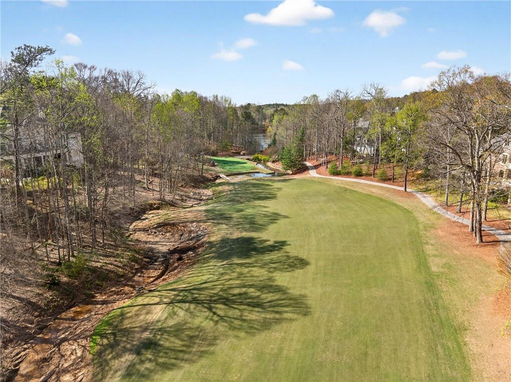 5040 Harrington Road Alpharetta, GA 30022 - Photo 3 of 54 a view of a swimming pool with a yard and mountain view