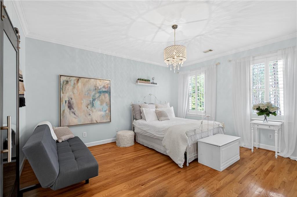 5040 Harrington Road Alpharetta, GA 30022 - Photo 34 of 54 a spacious bedroom with a bed and window