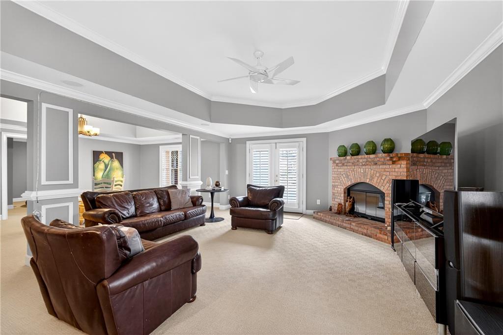 5040 Harrington Road Alpharetta, GA 30022 - Photo 41 of 54 a living room with furniture and a fireplace