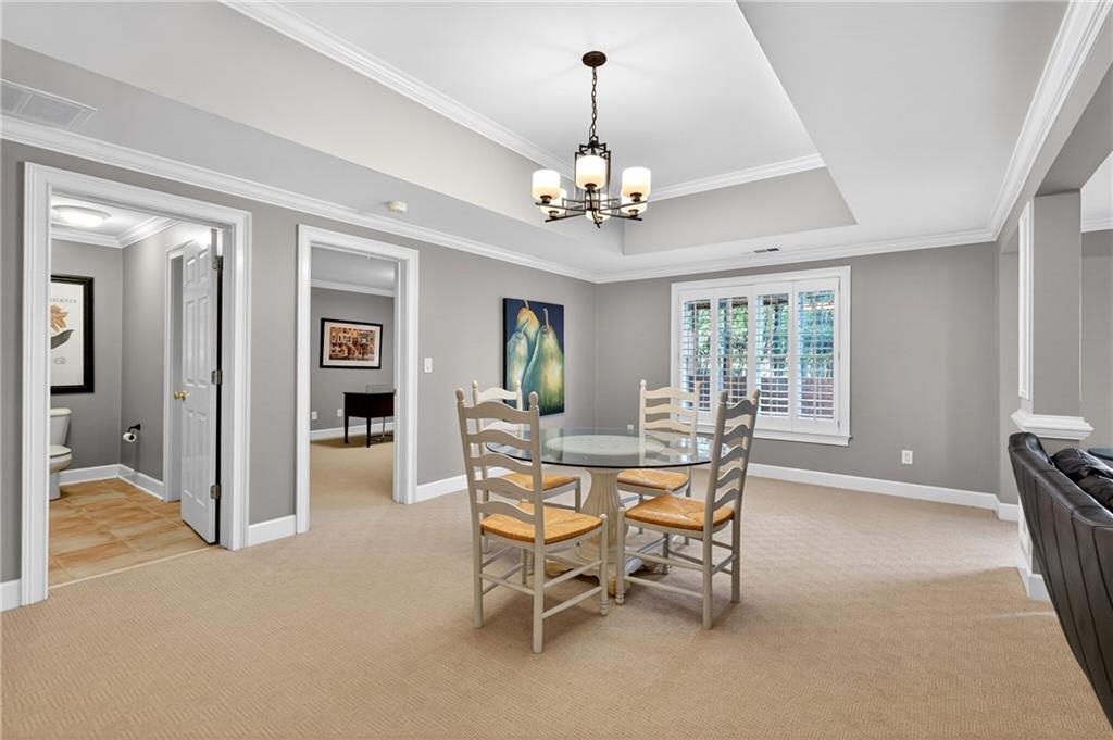 5040 Harrington Road Alpharetta, GA 30022 - Photo 43 of 54 a view of a livingroom with furniture and a chandelier