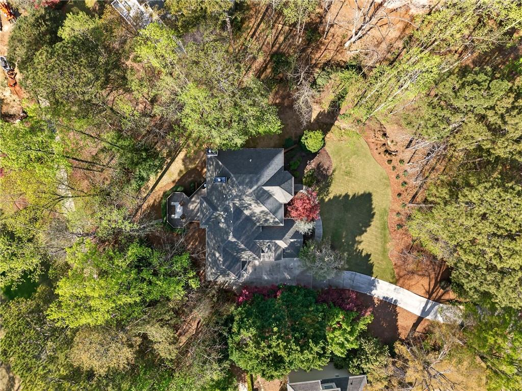 5040 Harrington Road Alpharetta, GA 30022 - Photo 5 of 54 a view of a tree in front of a house
