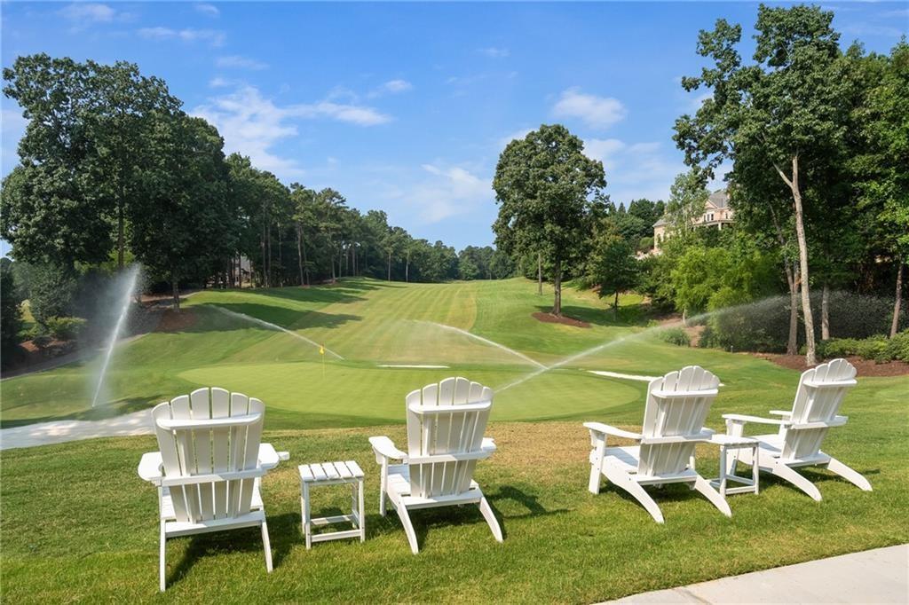 5040 Harrington Road Alpharetta, GA 30022 - Photo 51 of 54 a view of a wooden chairs and table in the patio
