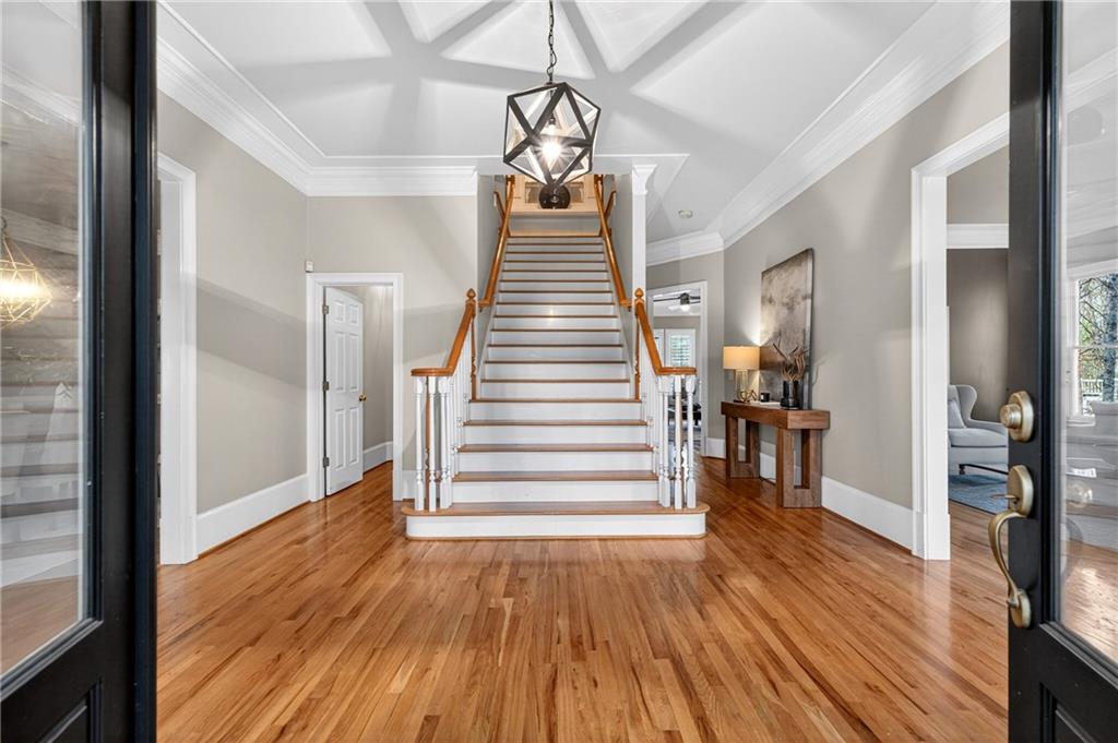 5040 Harrington Road Alpharetta, GA 30022 - Photo 7 of 54 a view of a hallway view with wooden floor and staircase
