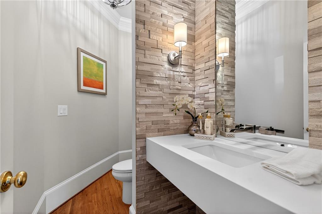 5040 Harrington Road Alpharetta, GA 30022 - Photo 9 of 54 a bathroom with a sink and a mirror