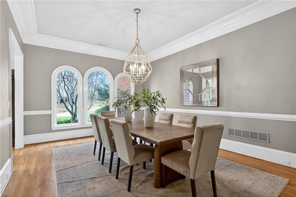 5040 Harrington Road Alpharetta, GA 30022 - Photo 10 of 54 a dining room with furniture a chandelier and window