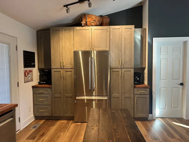 a kitchen with a sink and cabinets