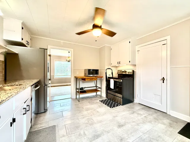 a view of an empty room and window