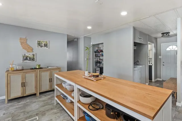 a room with a bed and a dresser