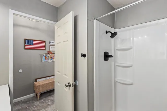 a bathroom with a shower and a toilet