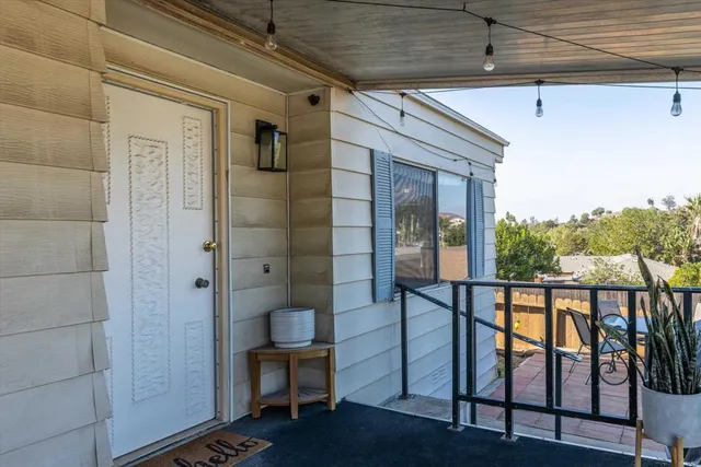 a view of balcony and wooden floor