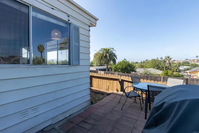 a view of balcony with furniture