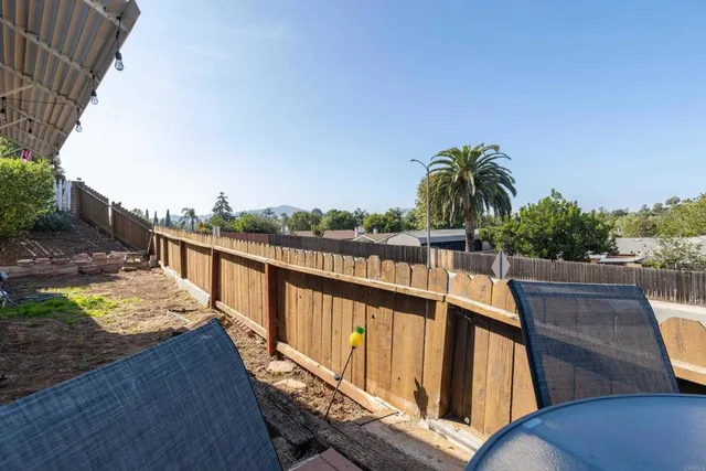 a view of a pathway with a house in the background