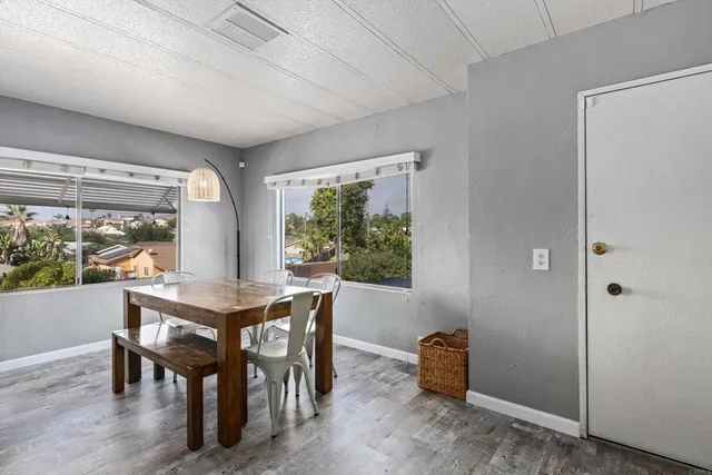 a view of a dining room with furniture window and outside view