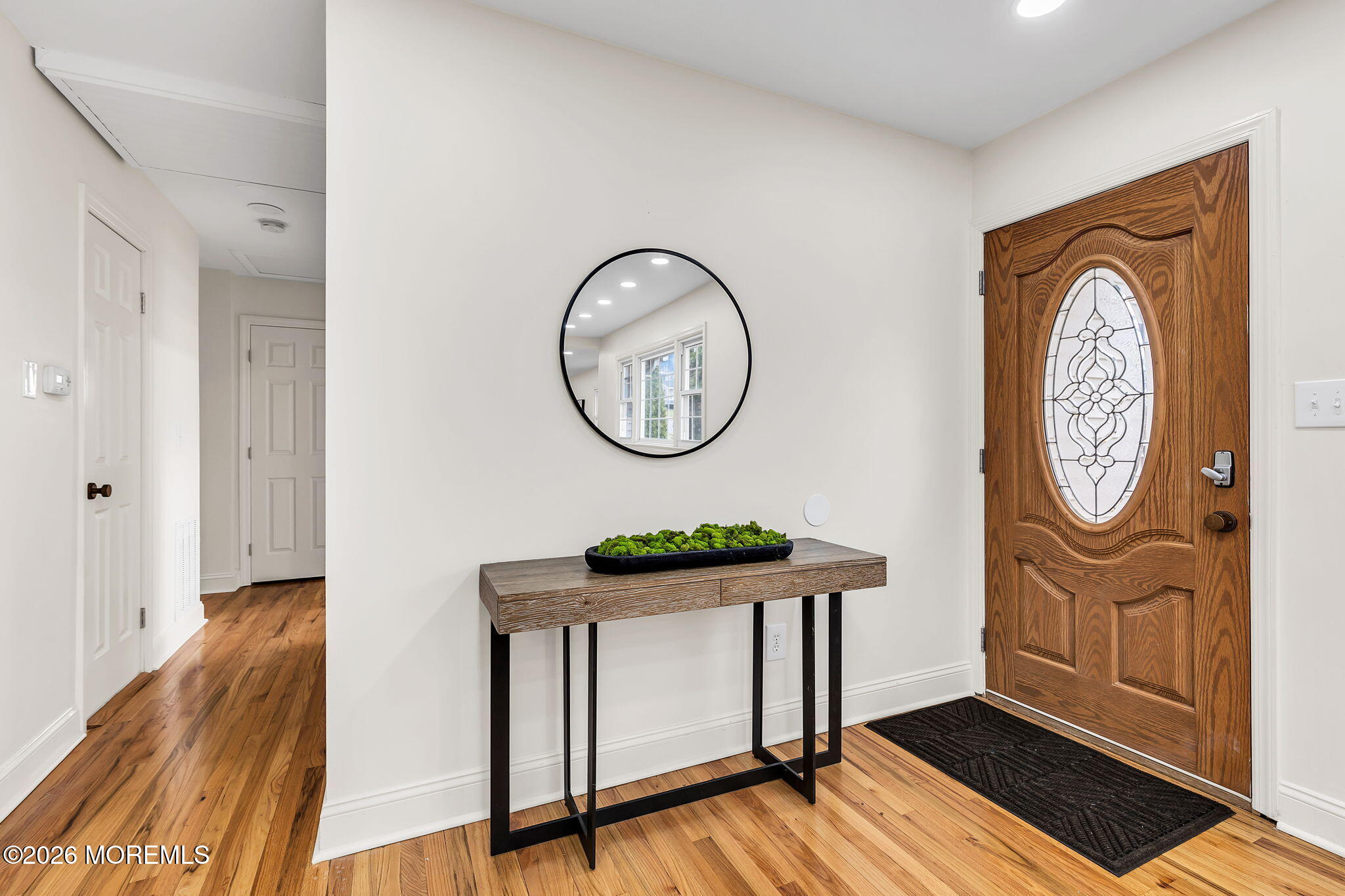 50 Westbrook Road Howell, NJ 07731 - Photo 7 of 73 a view of a hallway with wooden floor and front door