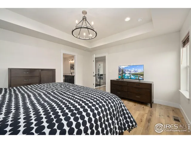 a bathroom with a tub a sink and mirror