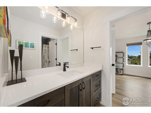 a kitchen with a stove a cabinets and a dining table