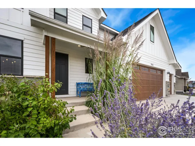 a view of a house with a small yard