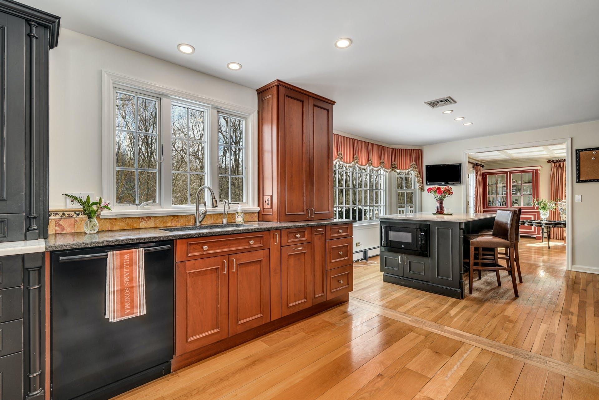 258 Jonathan Road New Canaan, CT 06840 - Photo 14 of 33 a open kitchen with stainless steel appliances granite countertop a stove and a sink with granite countertops