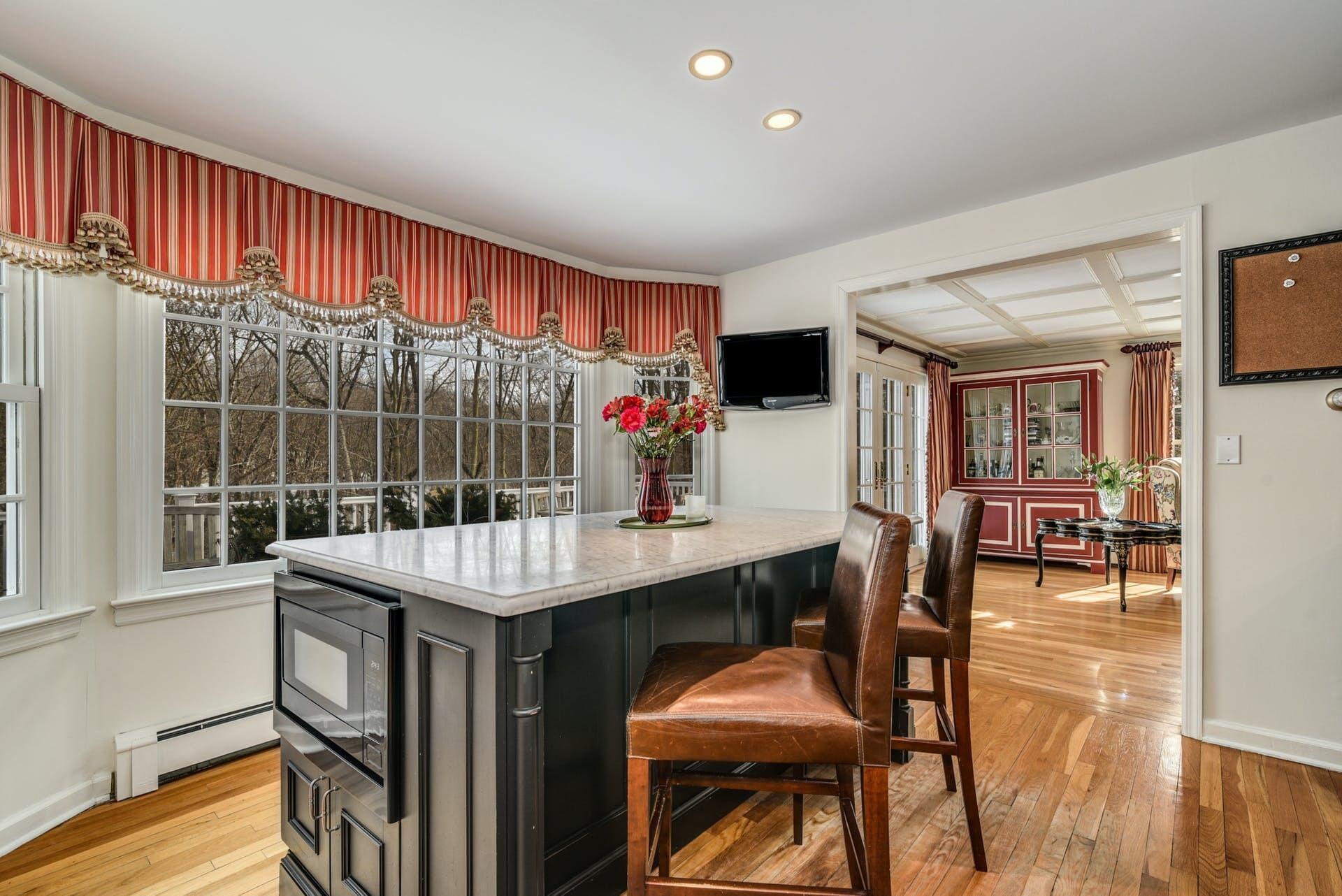 258 Jonathan Road New Canaan, CT 06840 - Photo 15 of 33 a view of a dining room with furniture window and wooden floor