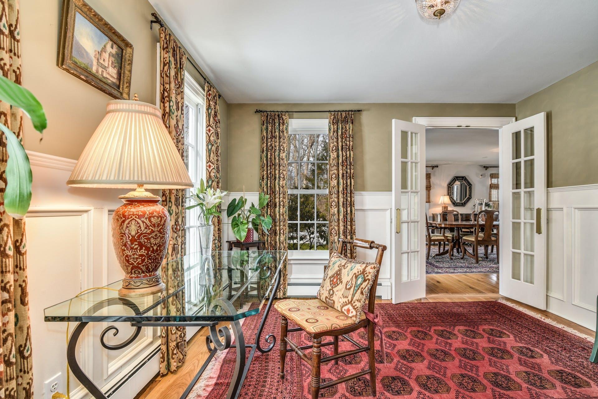 258 Jonathan Road New Canaan, CT 06840 - Photo 17 of 33 a view of a dining room with furniture and wooden floor