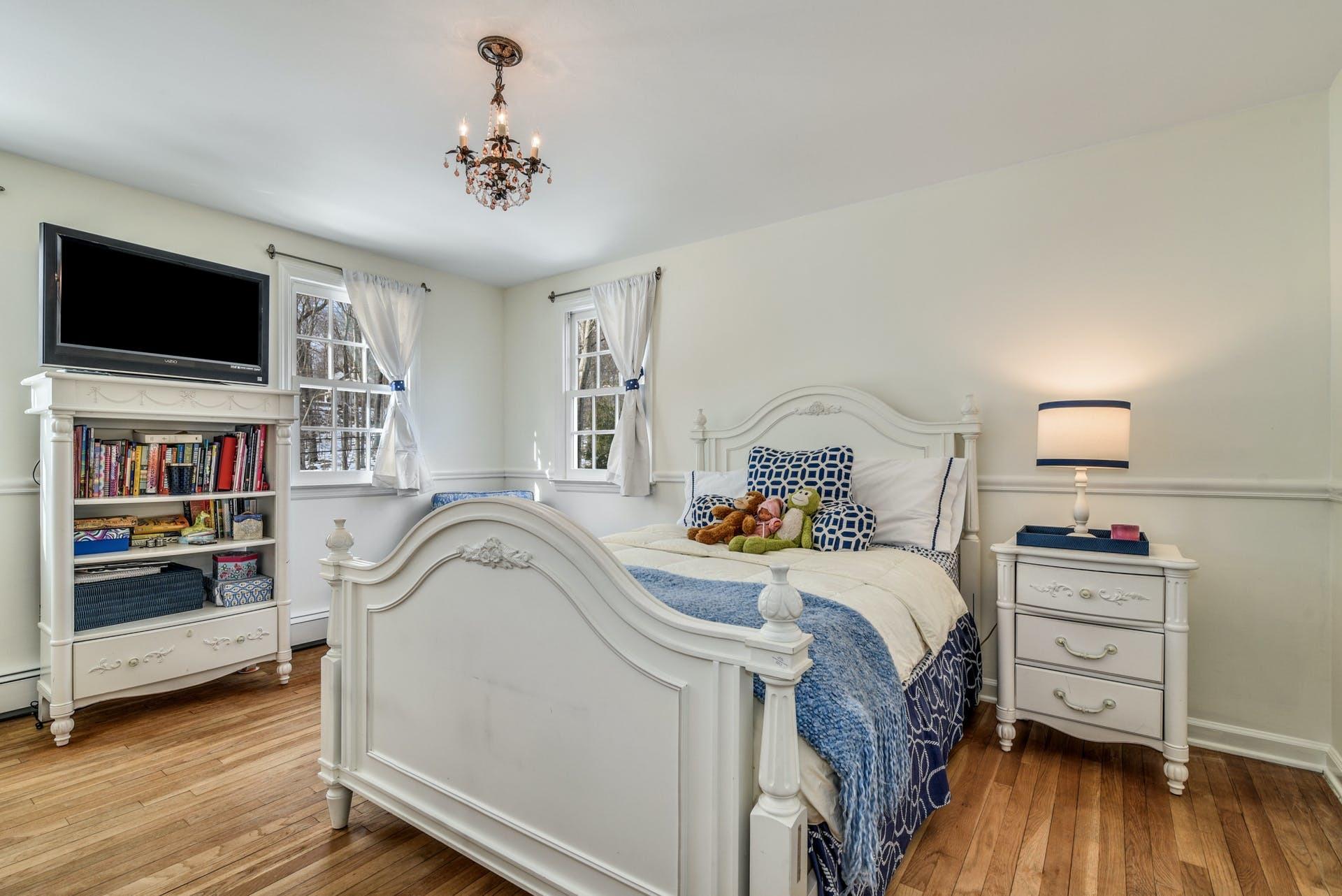 258 Jonathan Road New Canaan, CT 06840 - Photo 22 of 33 a bedroom with a bed and a flat screen tv