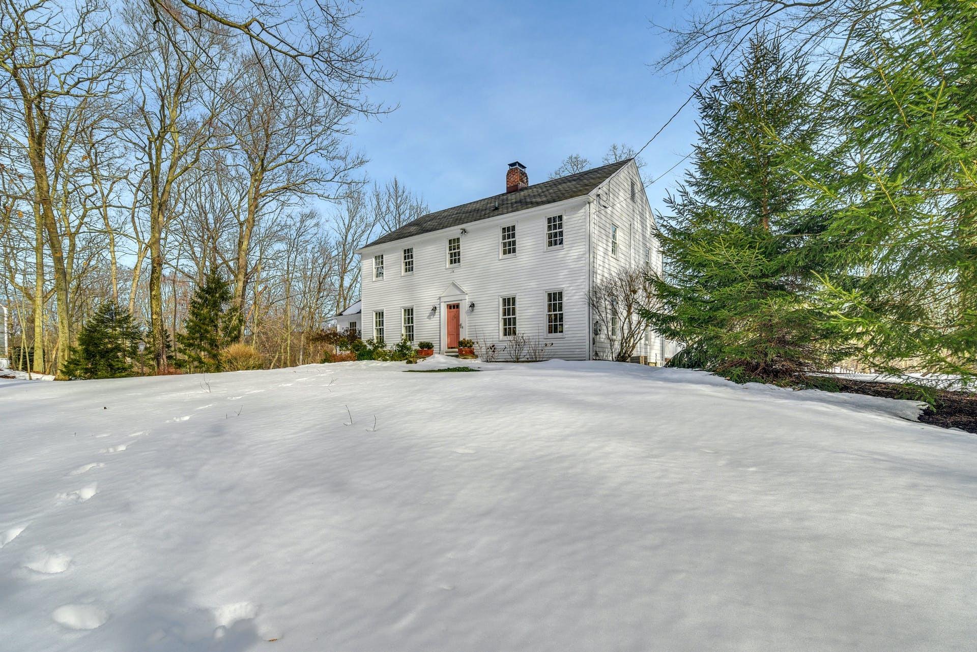 258 Jonathan Road New Canaan, CT 06840 - Photo 4 of 33 a view of large house with a street