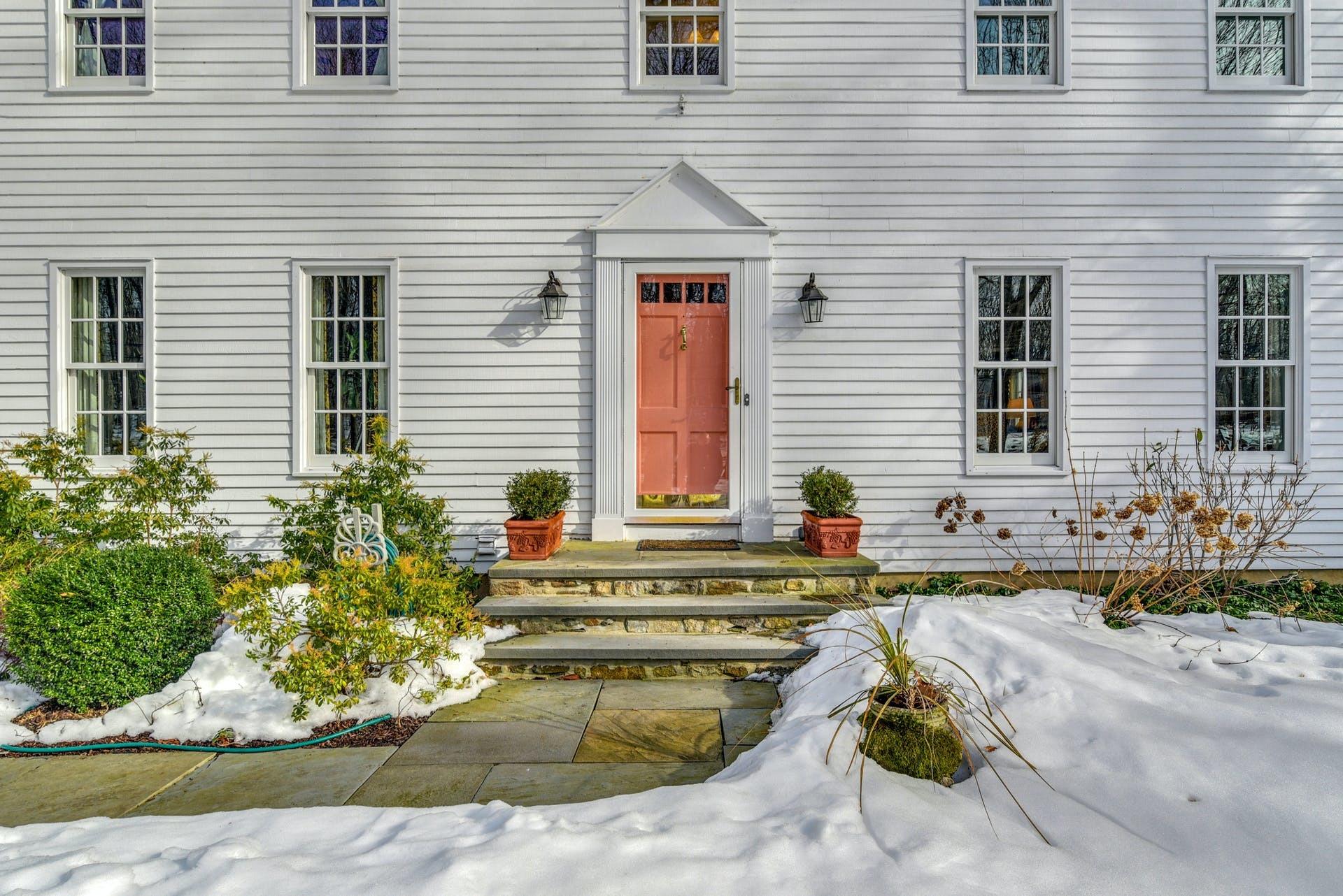 258 Jonathan Road New Canaan, CT 06840 - Photo 5 of 33 a view of a house with a chairs and potted plant