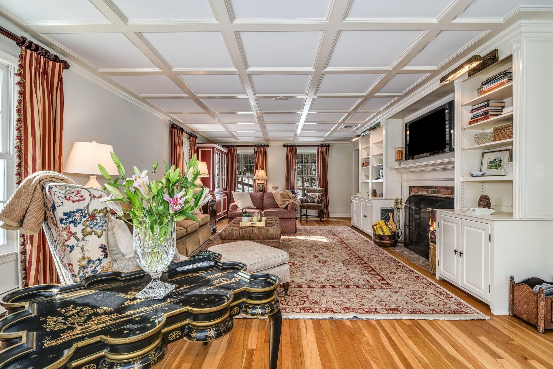258 Jonathan Road New Canaan, CT 06840 - Photo 8 of 33 a living room with fireplace furniture and a flat screen tv