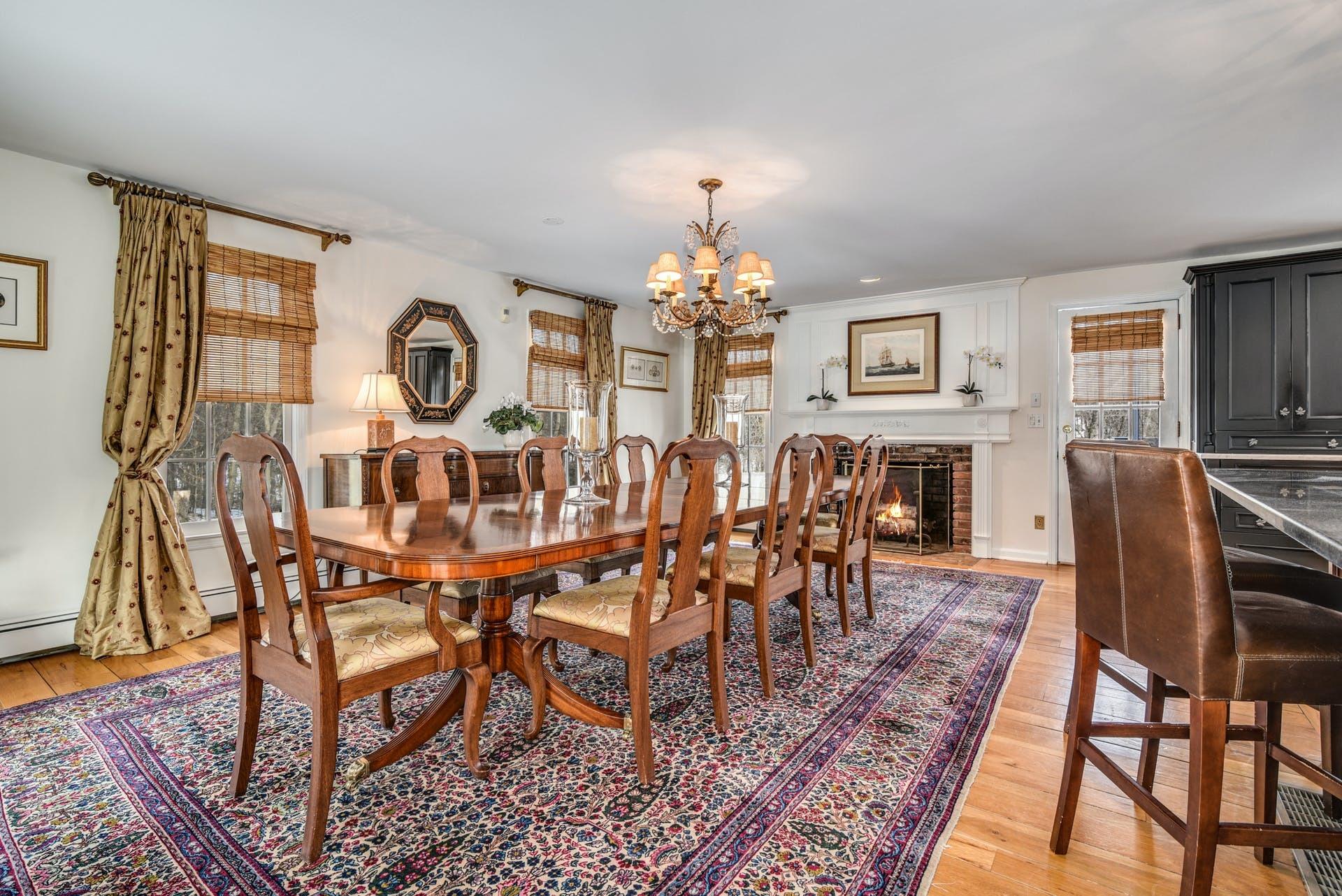 258 Jonathan Road New Canaan, CT 06840 - Photo 10 of 33 a view of a dining room with furniture and chandelier