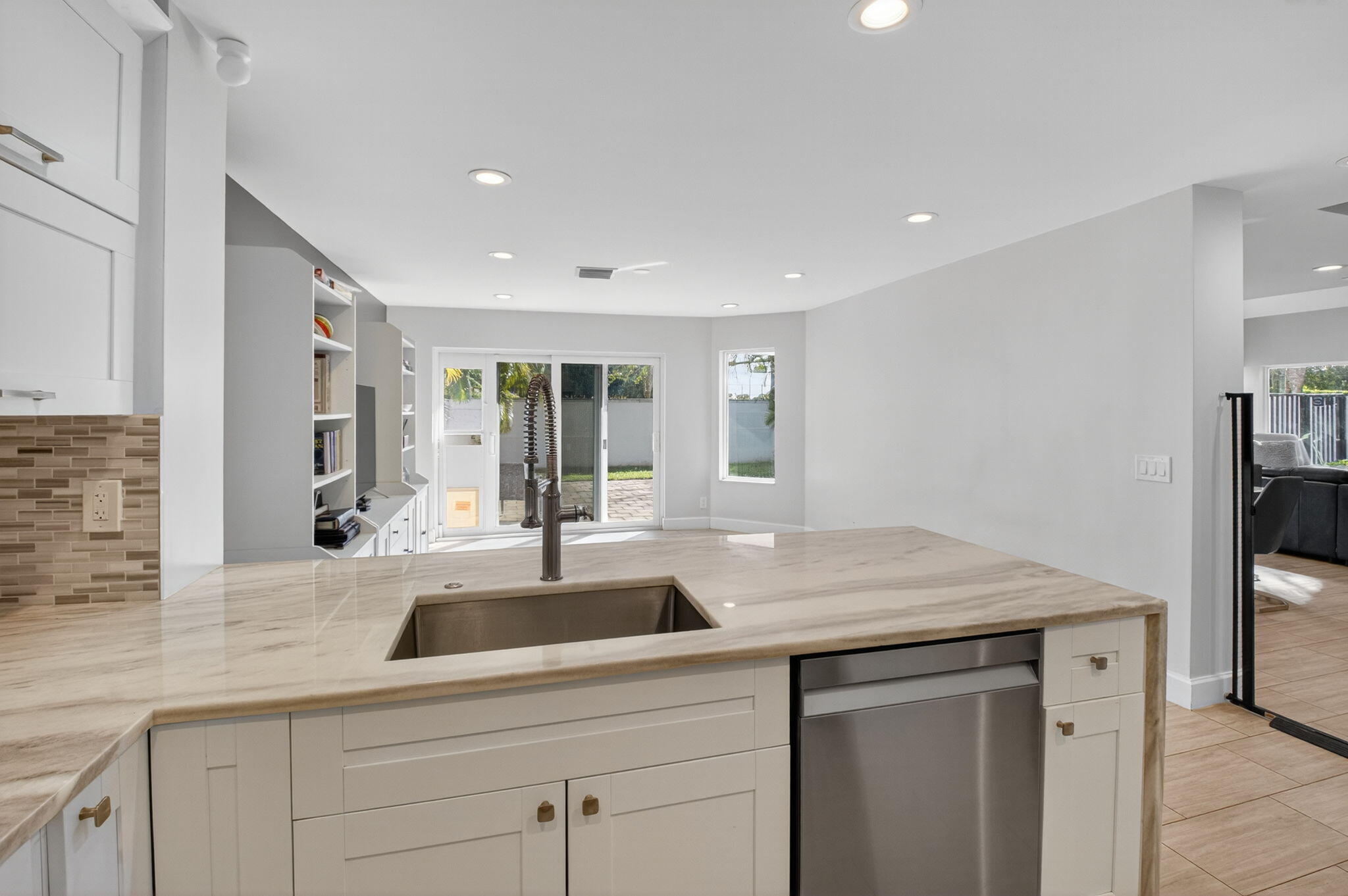2226 Northwest 52nd Street Boca Raton, FL 33496 - Photo 18 of 49 a kitchen with a sink and cabinets