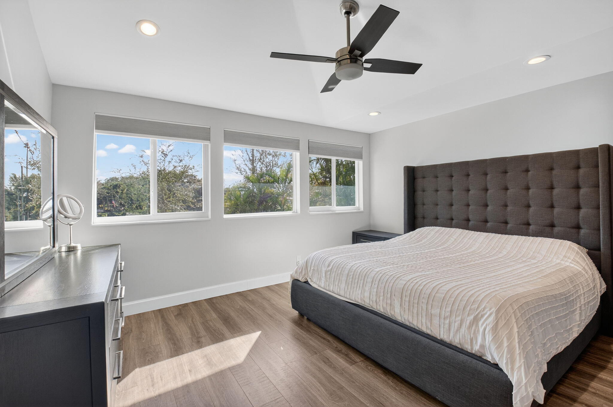 2226 Northwest 52nd Street Boca Raton, FL 33496 - Photo 23 of 49 a bedroom with a large bed and a large window