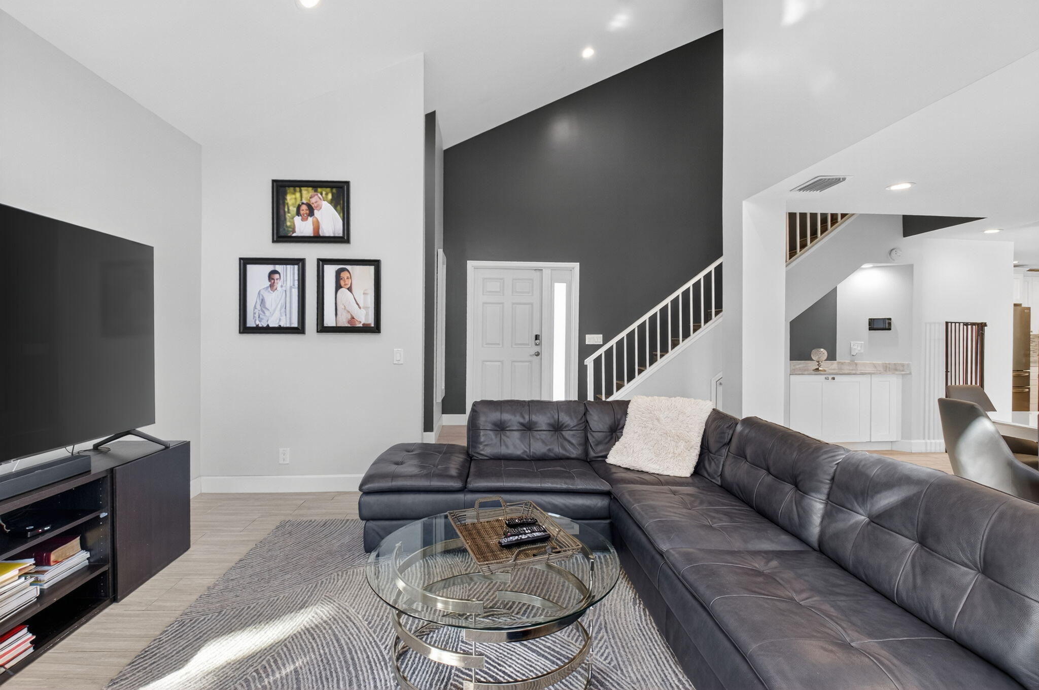 2226 Northwest 52nd Street Boca Raton, FL 33496 - Photo 7 of 49 a living room with furniture and a flat screen tv
