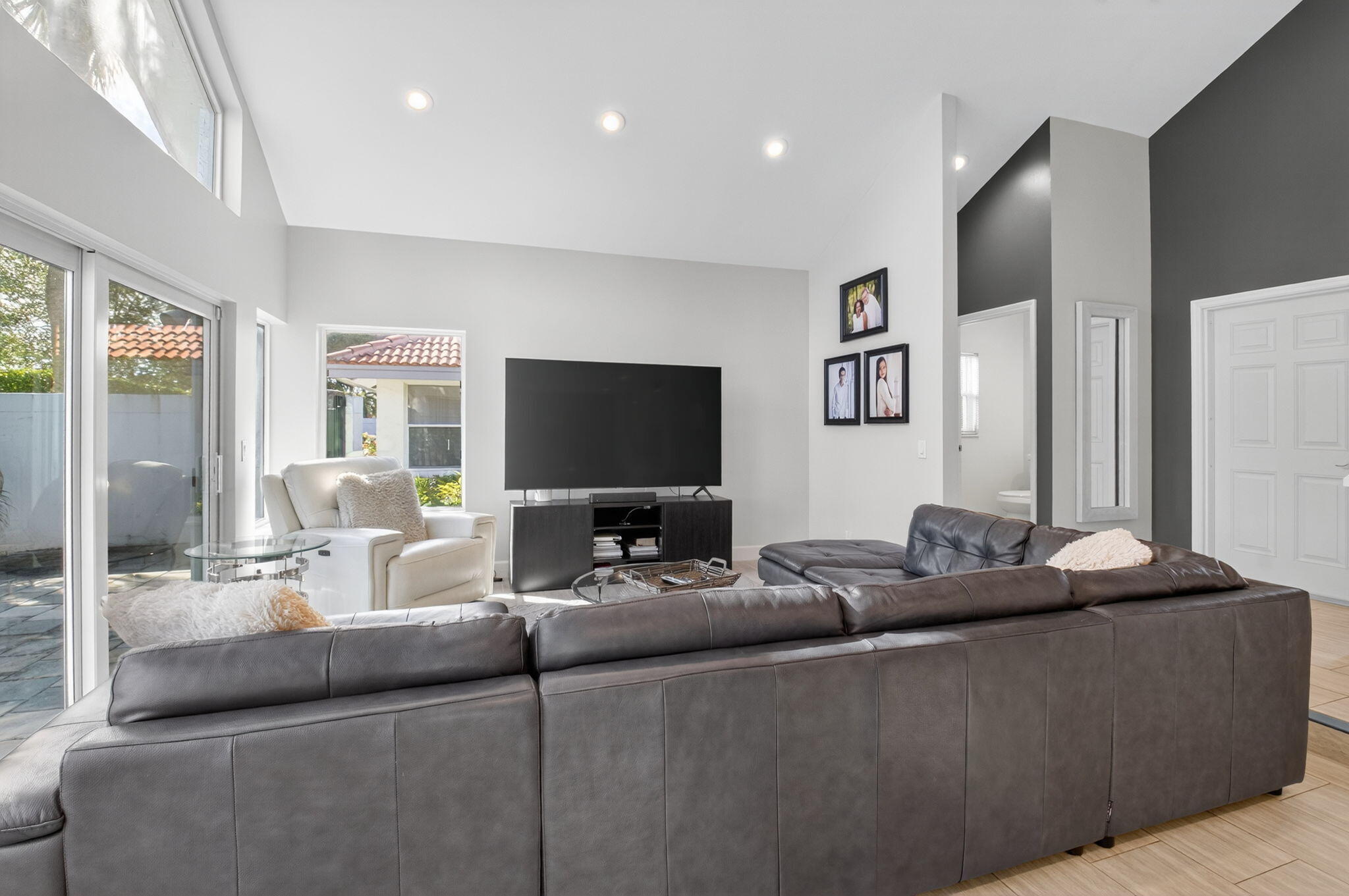 2226 Northwest 52nd Street Boca Raton, FL 33496 - Photo 8 of 49 a living room with furniture and a flat screen tv