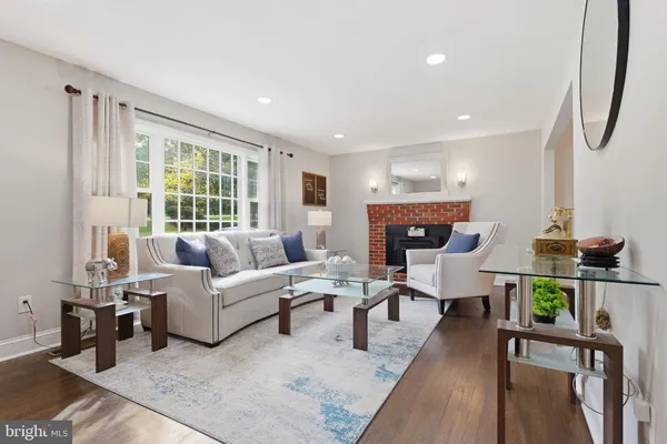 a bedroom with a bed and a flat tv screen on dresser