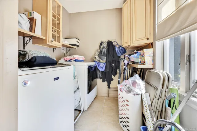 a bathroom with a toilet a sink and a window