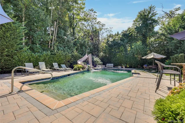 a view of a backyard with sitting area