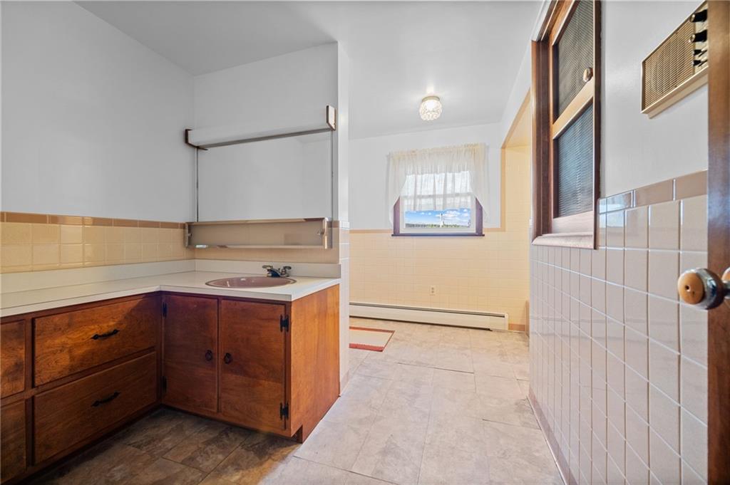 905 Watt Road Apollo, PA 15613 - Photo 18 of 30 a kitchen with cabinets and white appliances